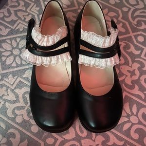 Cute white ruffle, flats, black, squared off toe.